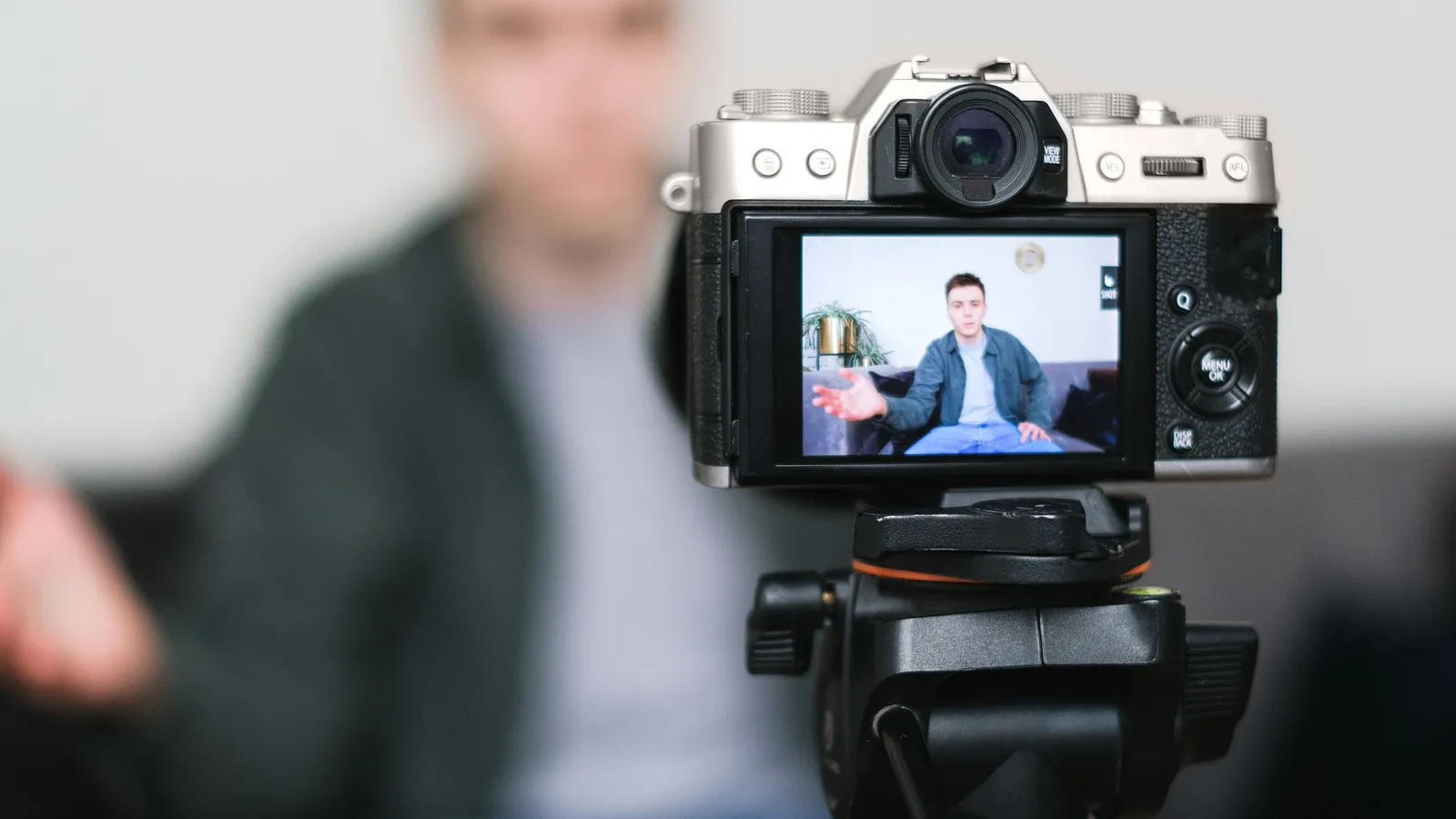A creator filming content on their phone at home